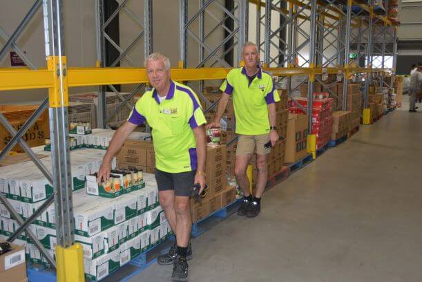 two men in food warehouse