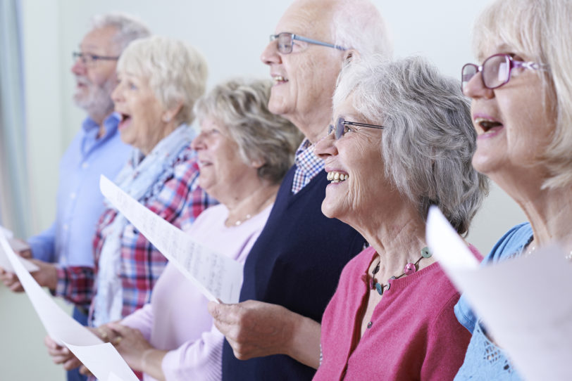 Older people singing in a choir